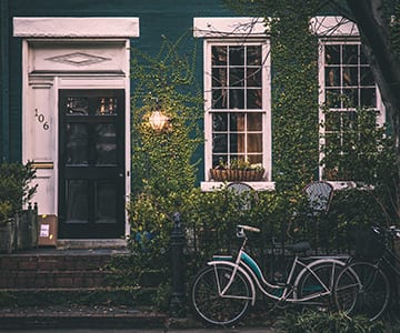 Image of bike in front of a house for the Tennessee website design of JLB, noted the best web design company in Nashville, Brentwood and Franklin TN with SEO, inbound marketing, graphic design and web support services all in-house.